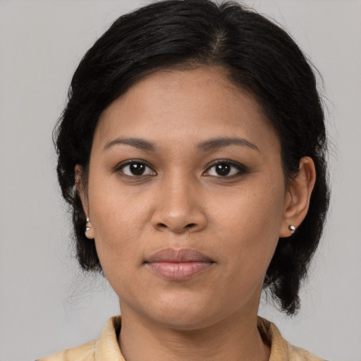 Joyful asian young-adult female with medium  brown hair and brown eyes