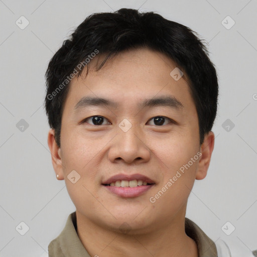 Joyful asian young-adult male with short  black hair and brown eyes