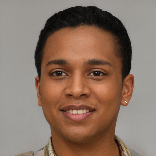 Joyful latino young-adult male with short  black hair and brown eyes