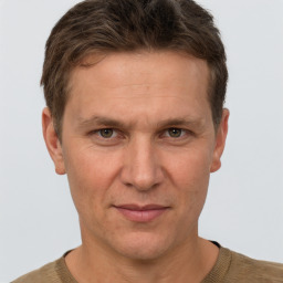 Joyful white adult male with short  brown hair and grey eyes