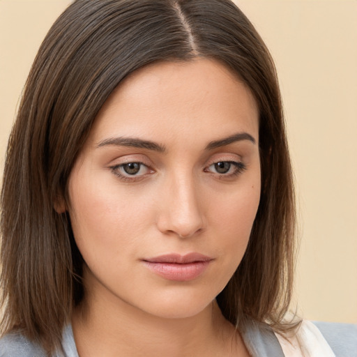 Neutral white young-adult female with medium  brown hair and brown eyes