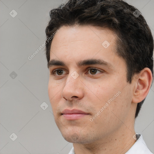 Neutral white young-adult male with short  black hair and brown eyes