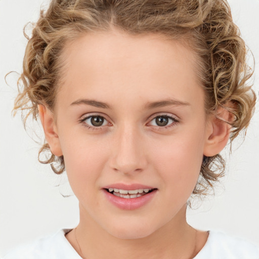 Joyful white child female with medium  brown hair and brown eyes