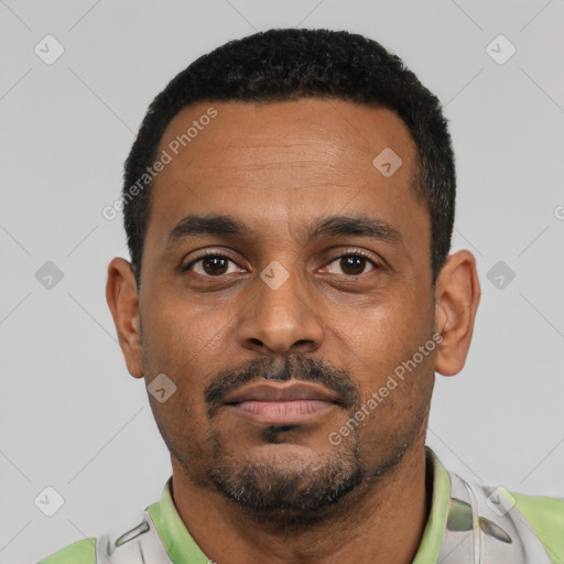 Neutral black young-adult male with short  black hair and brown eyes