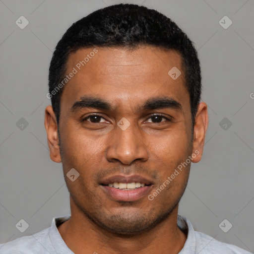 Joyful latino young-adult male with short  black hair and brown eyes