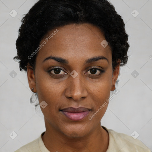 Joyful black young-adult female with short  black hair and brown eyes