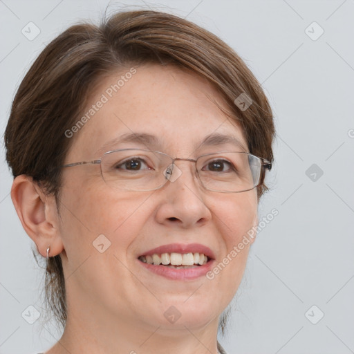 Joyful white adult female with medium  brown hair and brown eyes