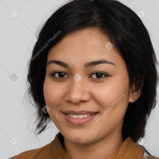 Joyful latino young-adult female with medium  brown hair and brown eyes