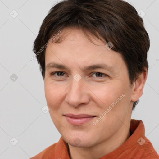 Joyful white adult female with short  brown hair and brown eyes