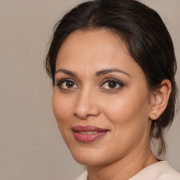 Joyful white adult female with medium  brown hair and brown eyes