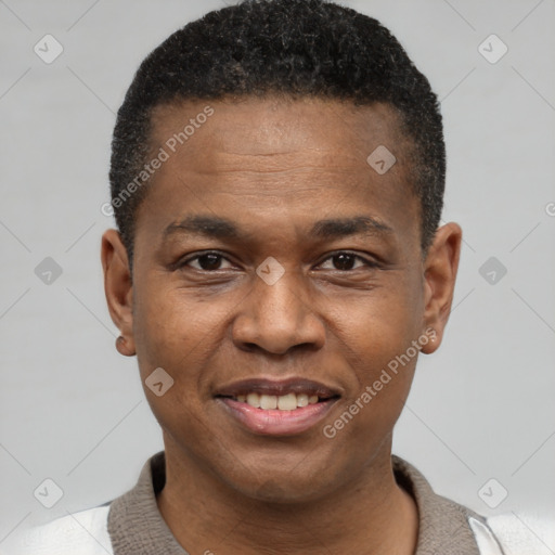 Joyful black young-adult male with short  black hair and brown eyes