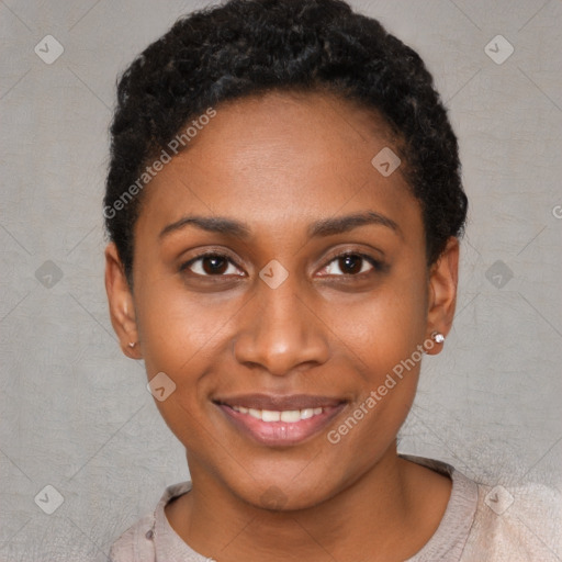 Joyful black young-adult female with short  black hair and brown eyes