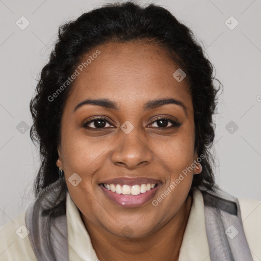 Joyful black young-adult female with long  brown hair and brown eyes