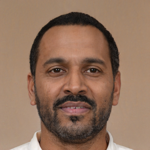 Neutral latino adult male with short  black hair and brown eyes
