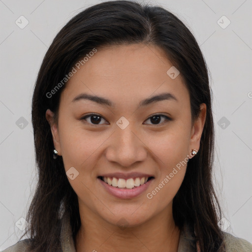 Joyful latino young-adult female with long  brown hair and brown eyes