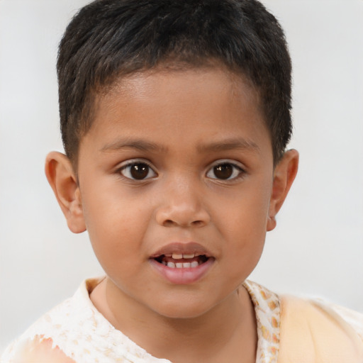 Joyful white child male with short  brown hair and brown eyes