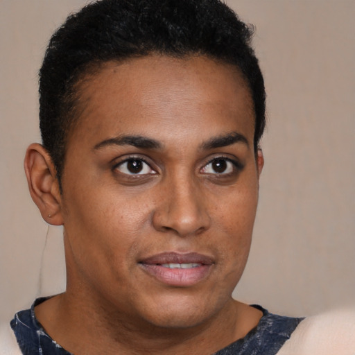 Joyful black young-adult male with short  brown hair and brown eyes