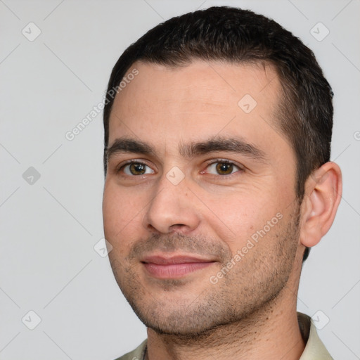 Joyful white young-adult male with short  brown hair and brown eyes