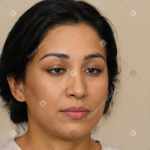 Joyful latino young-adult female with medium  brown hair and brown eyes