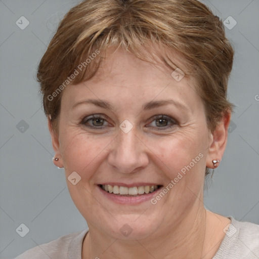 Joyful white adult female with short  brown hair and grey eyes