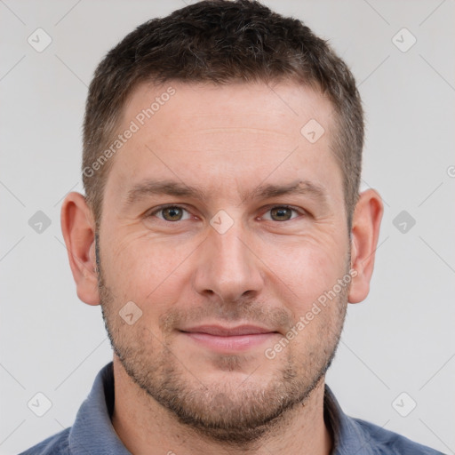 Joyful white adult male with short  brown hair and brown eyes