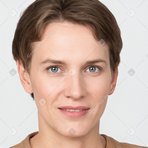 Joyful white young-adult female with short  brown hair and grey eyes