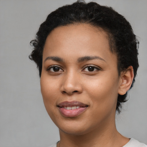 Joyful latino young-adult female with short  brown hair and brown eyes