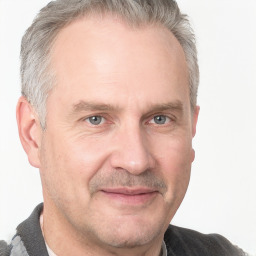 Joyful white adult male with short  brown hair and grey eyes