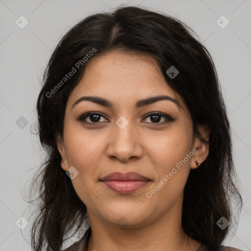 Joyful latino young-adult female with long  brown hair and brown eyes