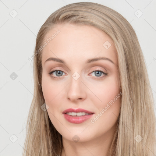 Joyful white young-adult female with long  brown hair and blue eyes