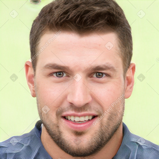 Joyful white young-adult male with short  brown hair and grey eyes