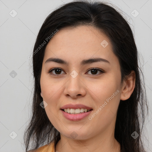 Joyful asian young-adult female with long  brown hair and brown eyes