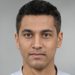 Neutral white young-adult male with short  black hair and brown eyes
