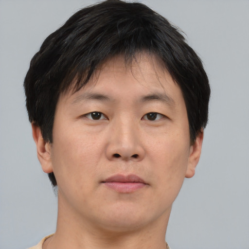 Neutral asian young-adult male with short  brown hair and brown eyes