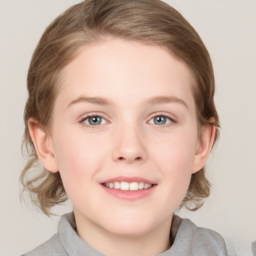 Joyful white child female with medium  brown hair and grey eyes