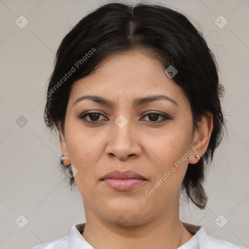 Joyful latino young-adult female with medium  brown hair and brown eyes