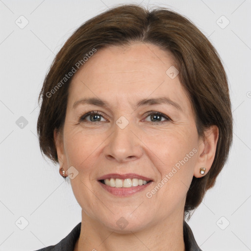 Joyful white adult female with medium  brown hair and grey eyes