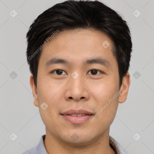 Joyful asian young-adult male with short  brown hair and brown eyes