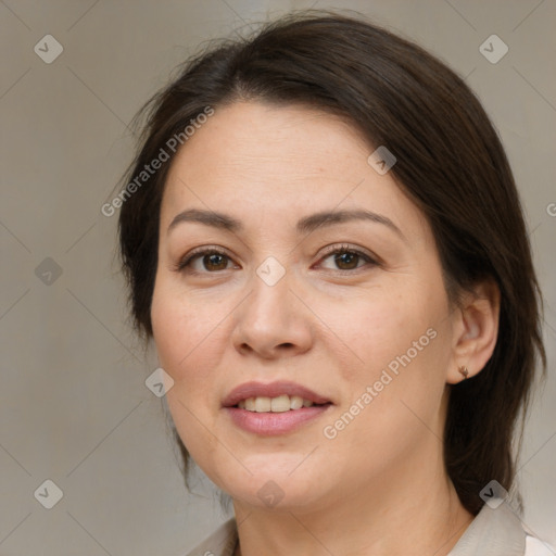 Joyful white adult female with medium  brown hair and brown eyes