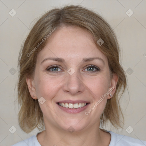 Joyful white adult female with medium  brown hair and grey eyes