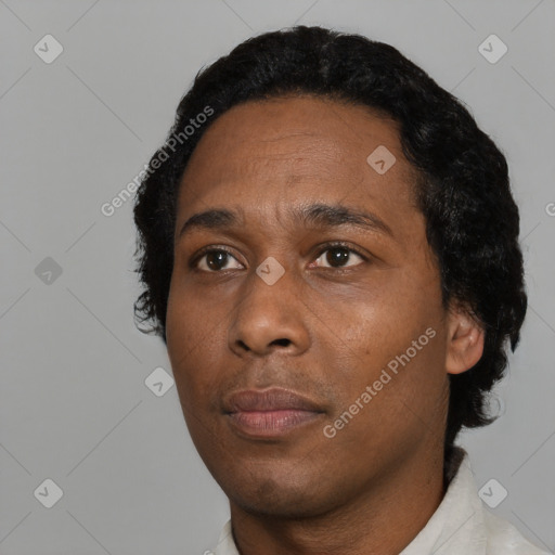 Neutral black young-adult male with short  black hair and brown eyes