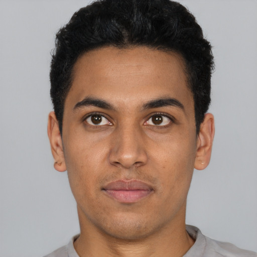Neutral latino young-adult male with short  black hair and brown eyes