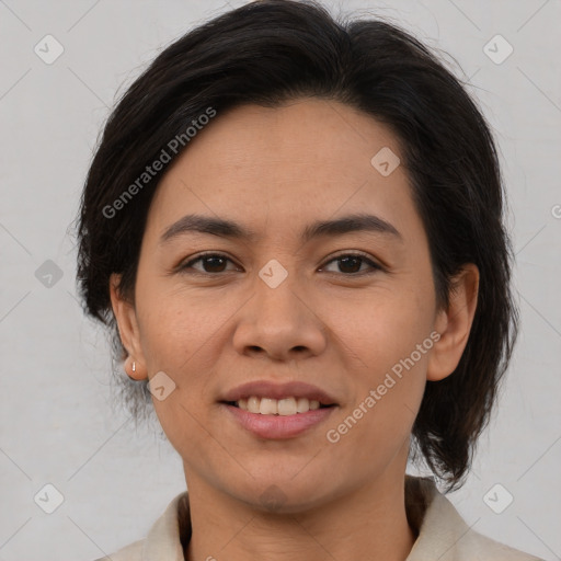 Joyful latino adult female with medium  brown hair and brown eyes