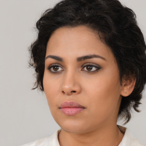 Neutral latino young-adult female with medium  brown hair and brown eyes