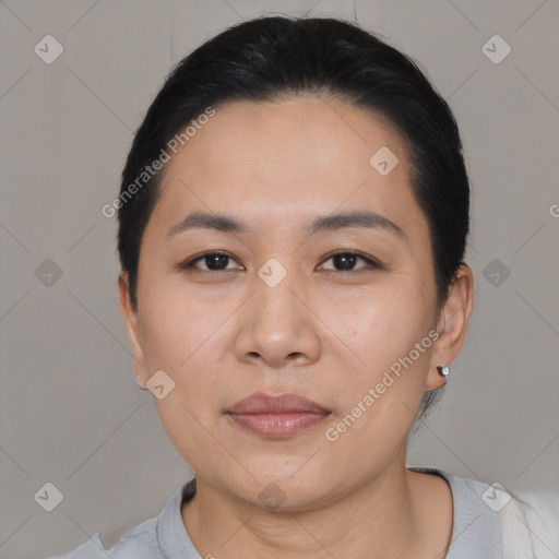 Joyful asian young-adult female with short  black hair and brown eyes