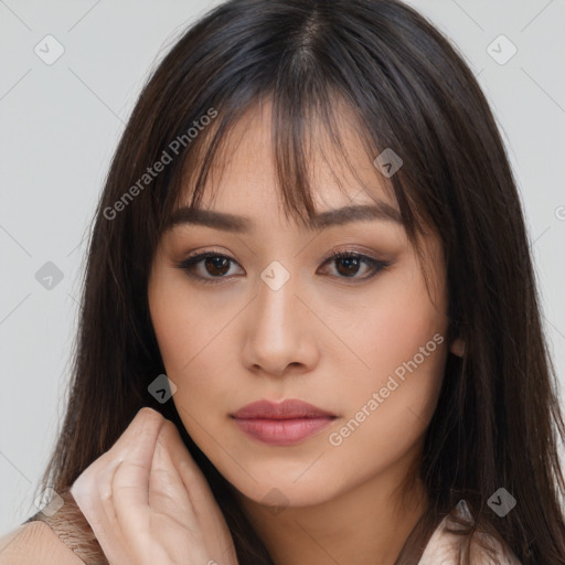 Neutral white young-adult female with long  brown hair and brown eyes