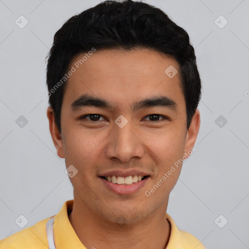 Joyful asian young-adult male with short  black hair and brown eyes