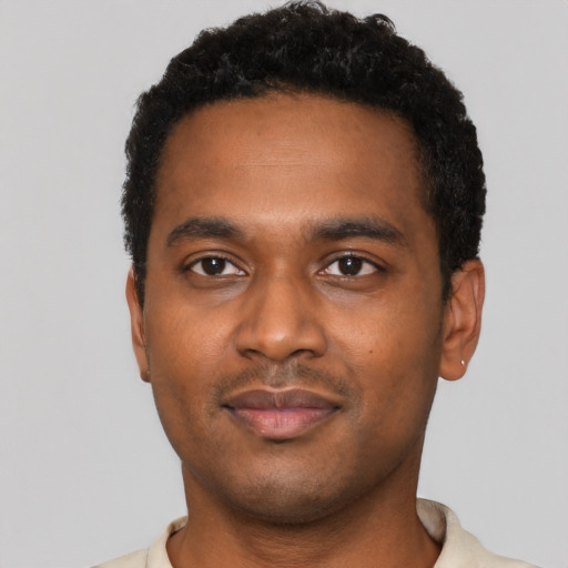 Neutral black young-adult male with short  black hair and brown eyes