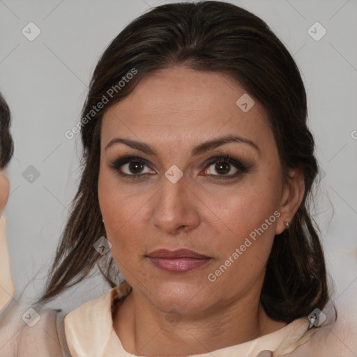 Joyful white adult female with medium  brown hair and brown eyes