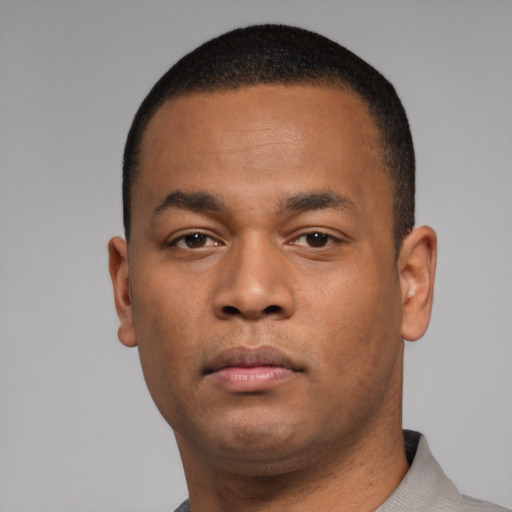 Neutral black young-adult male with short  black hair and brown eyes